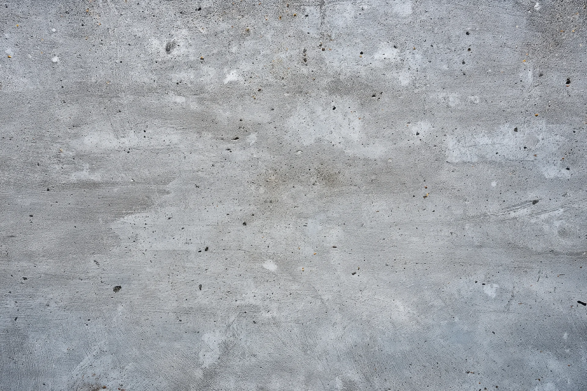 Weathered concrete surface with gray tones and rough texture showing signs of aging and wear