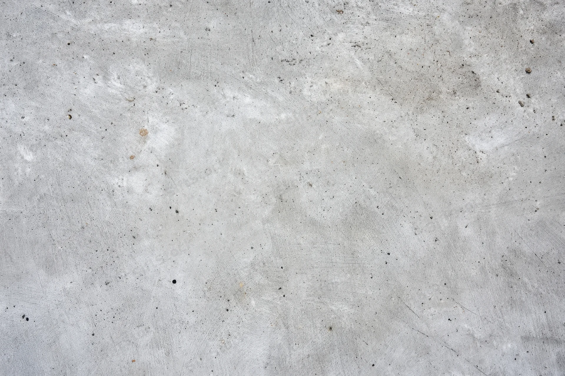 Weathered concrete surface with gray tones and speckled texture