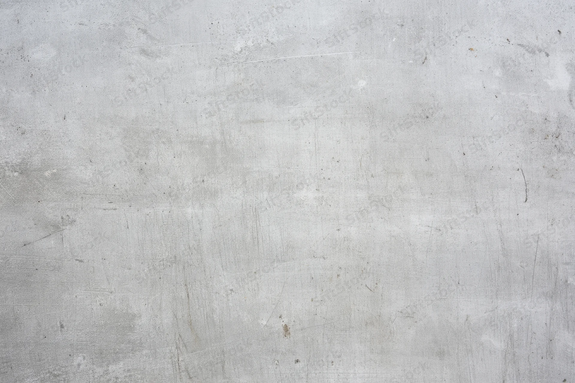 Weathered gray concrete wall with subtle scratches and marks