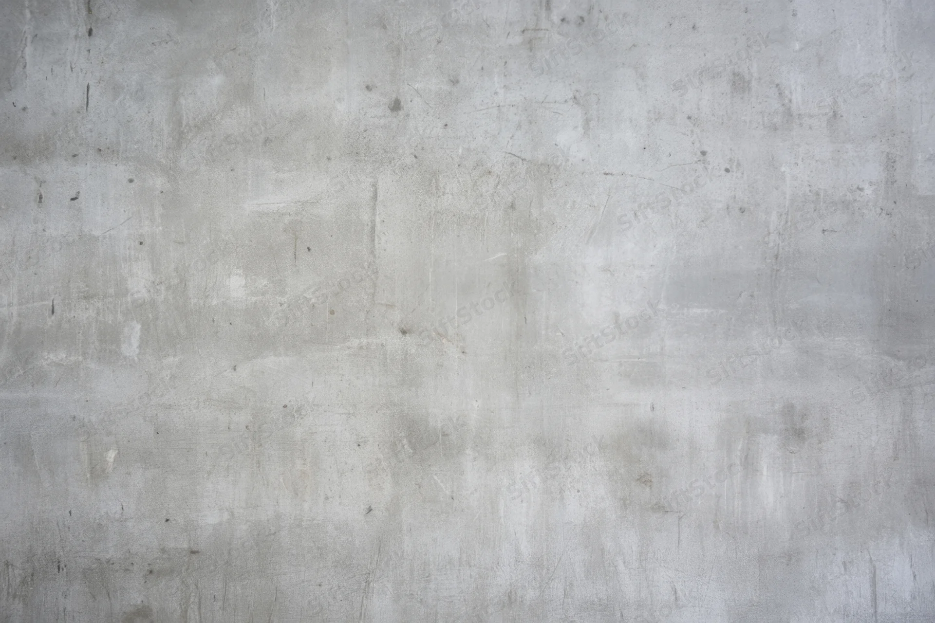 Weathered gray concrete wall with subtle scratches and faint stains covering the entire frame