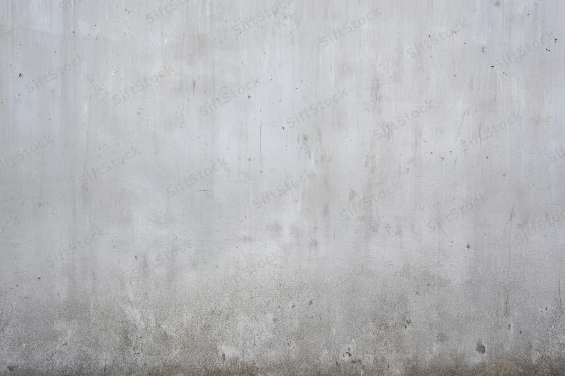 Weathered gray concrete wall with subtle scratches and stains