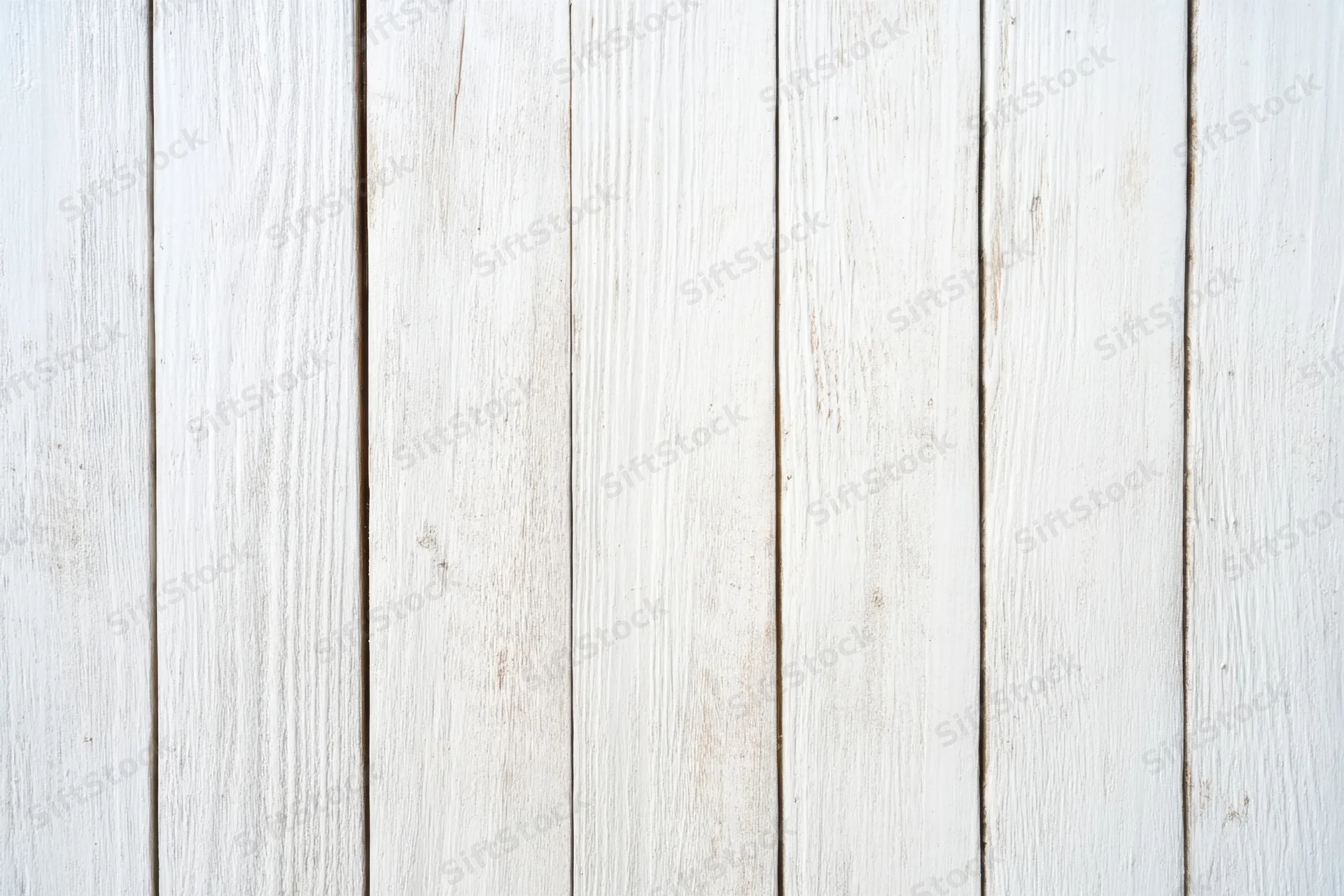 Whitewashed wooden planks arranged vertically as a textured wall surface