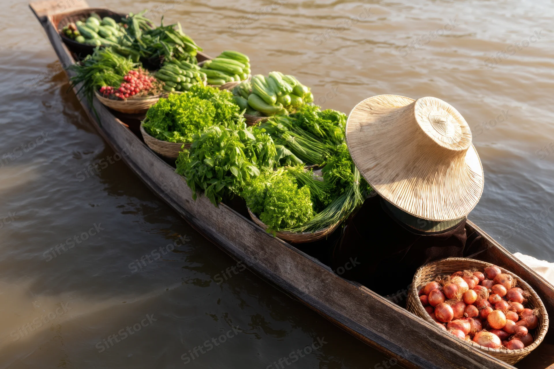 Woman vendor in a wooden boat filled with fresh vegetables at a floating market