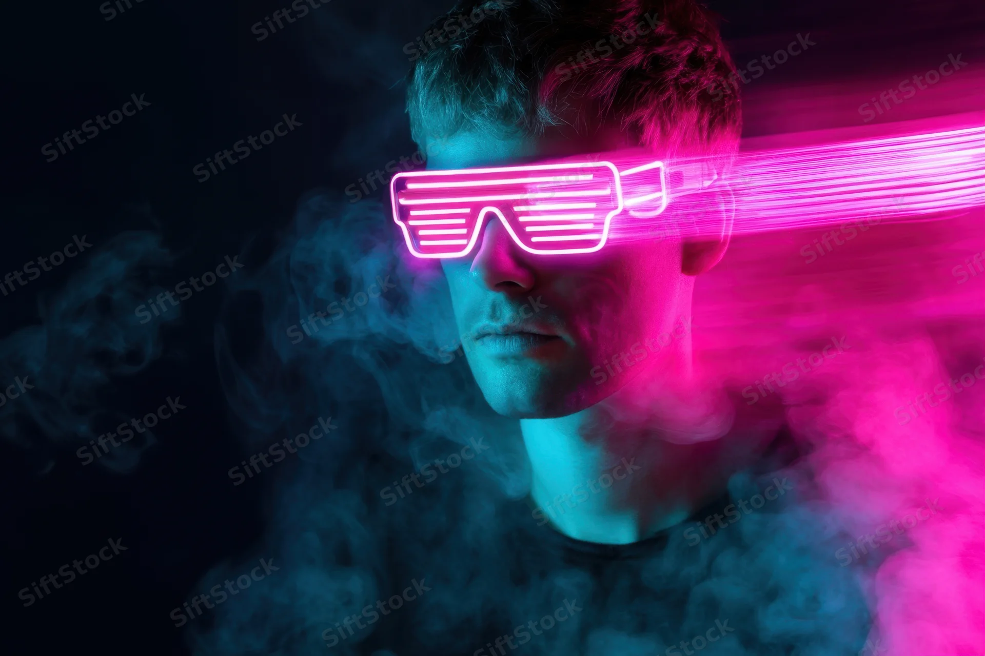 Man wearing glowing neon led sunglasses in a smoky dark environment