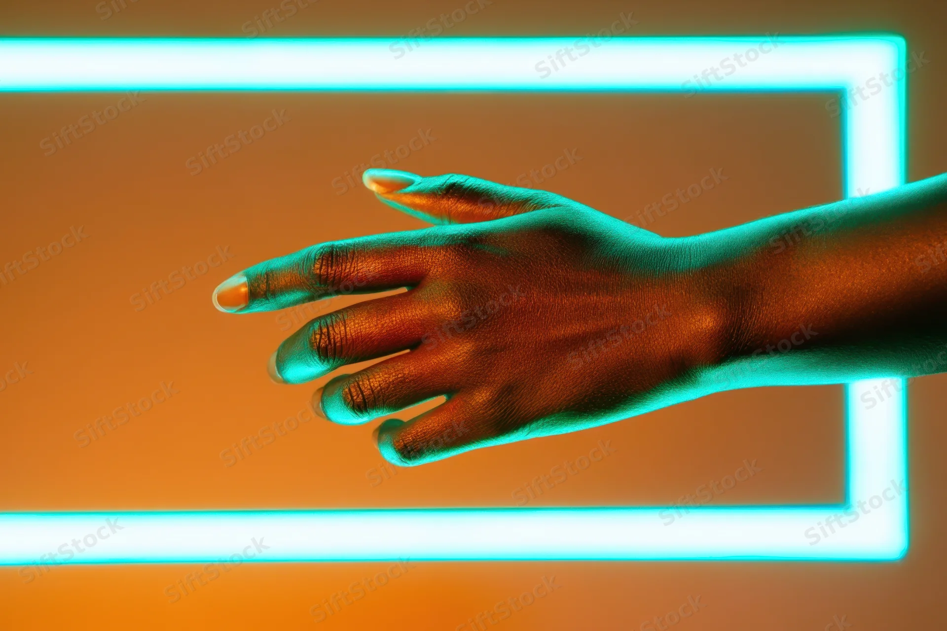 Black hand reaching through a glowing cyan neon frame in a studio setting