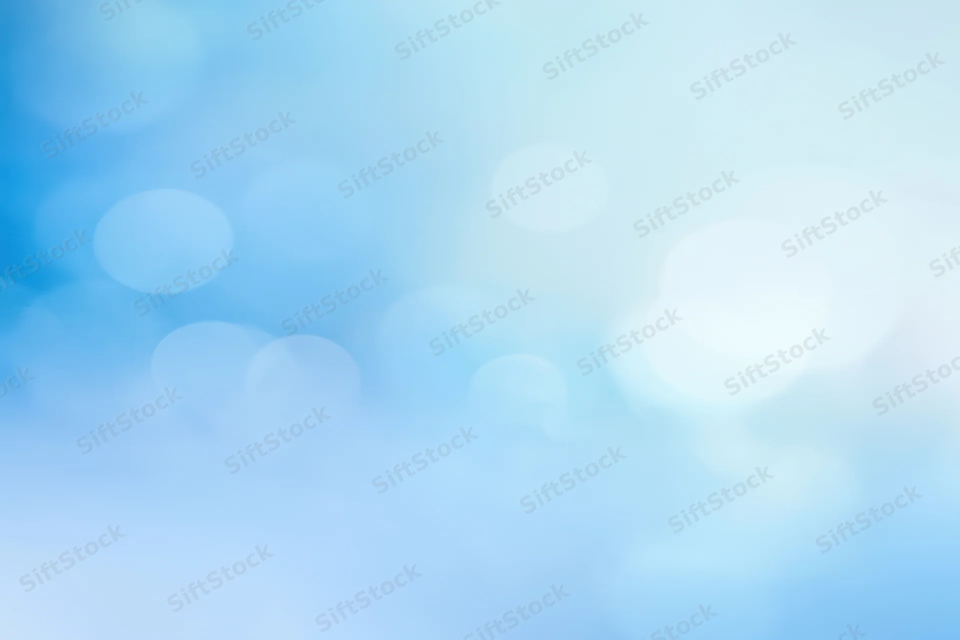 Soft blue gradient with blurred circular lights and gentle glow