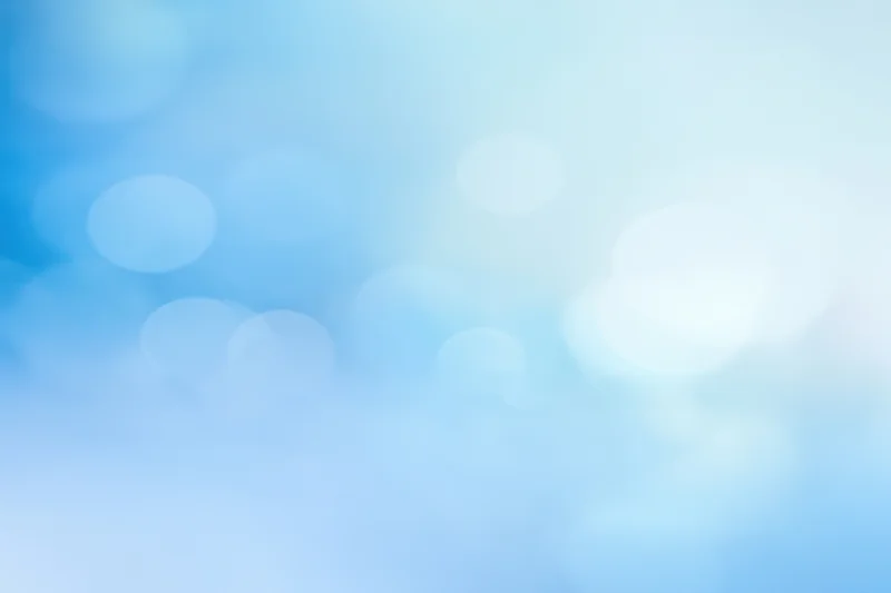 Soft blue gradient with blurred circular lights and gentle glow