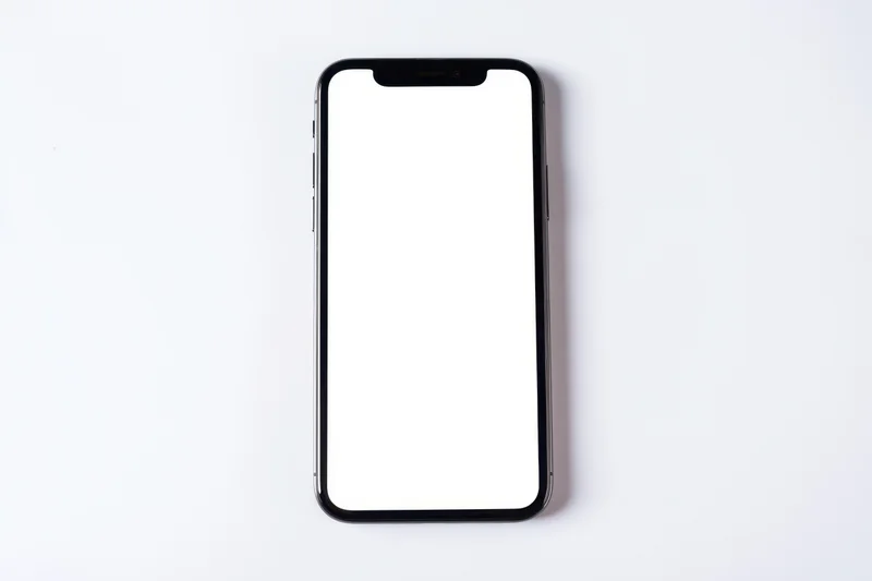Smartphone with blank white screen on white background