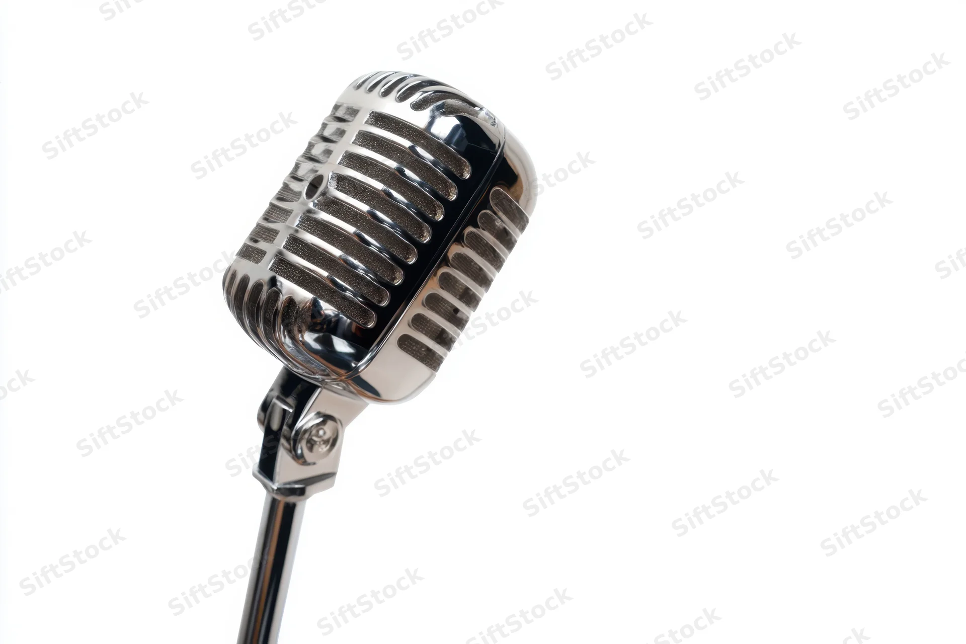Vintage chrome microphone on slim stand against white background