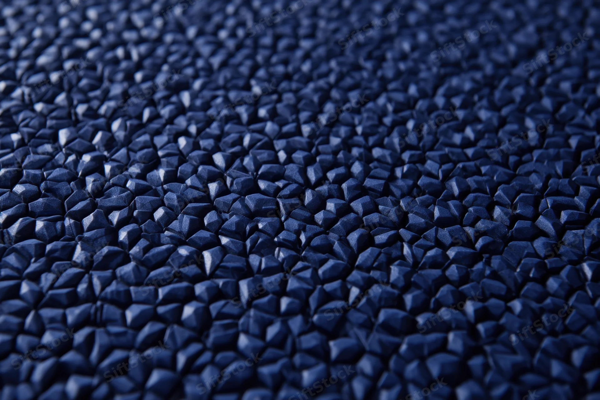 Close-up of dark blue hexagonal tessellated surface with geometric pattern