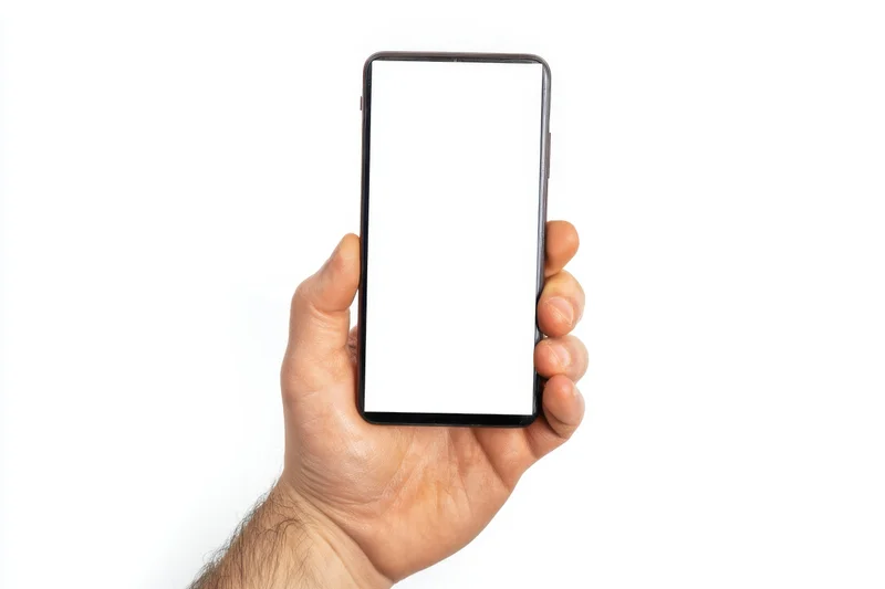 Hand holding smartphone with blank white screen against white background