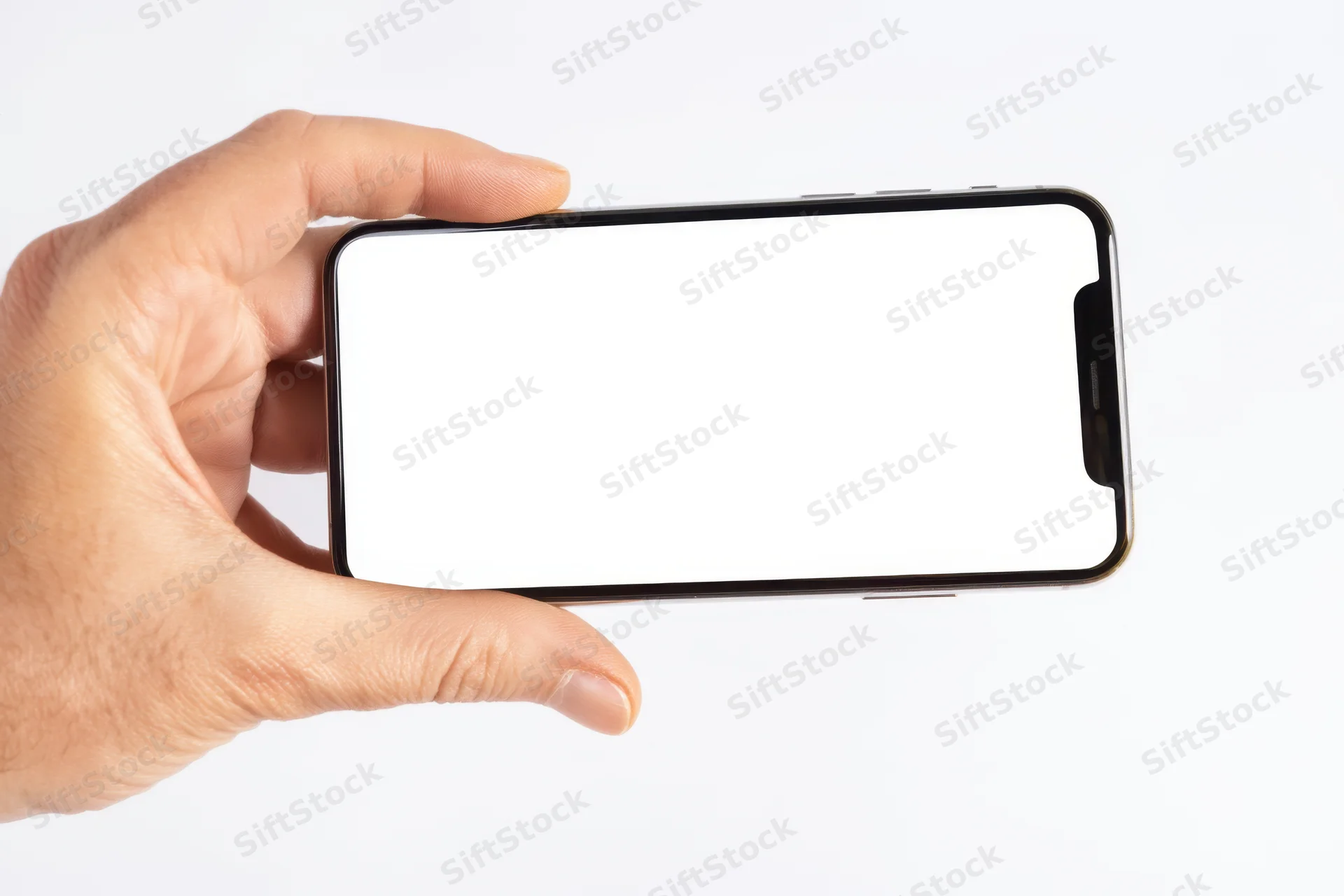 Hand holding smartphone with blank white screen against white background