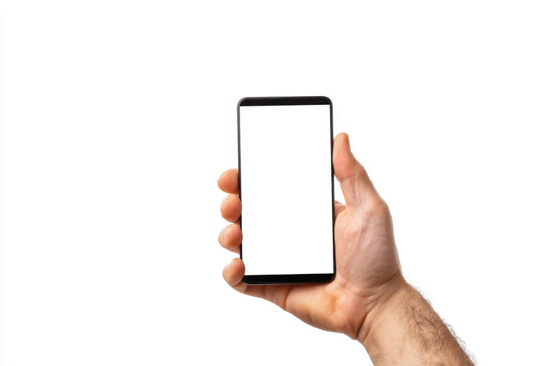 Hand holding smartphone with blank white screen against white background