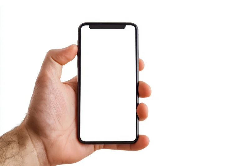Hand holding smartphone with blank white screen against white background