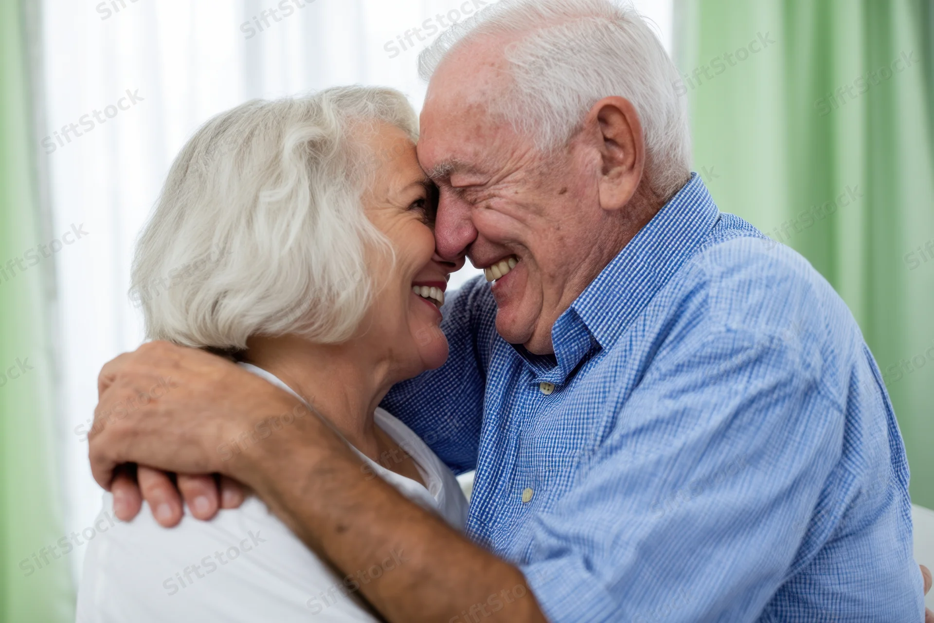 Senior couple embracing and smiling indoors