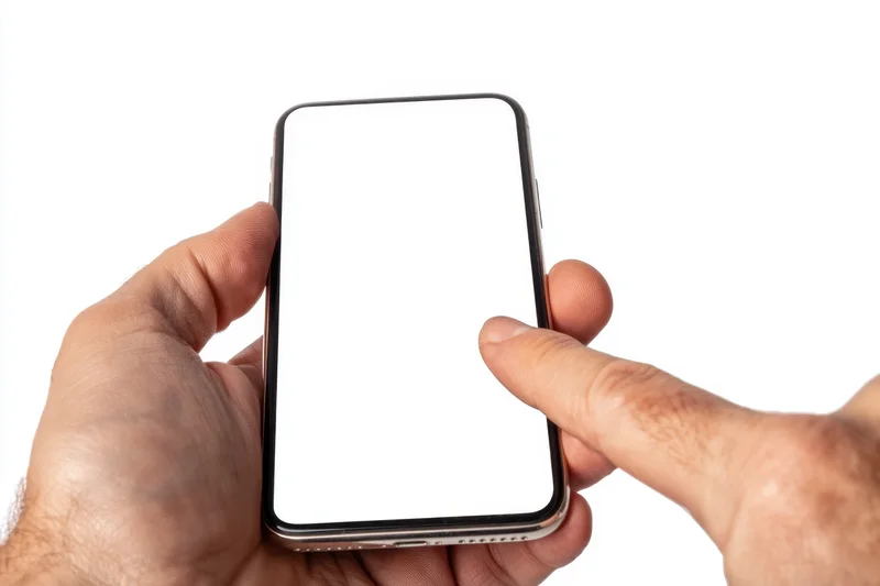 Hand holding smartphone with blank white screen, finger touching display, isolated on white background