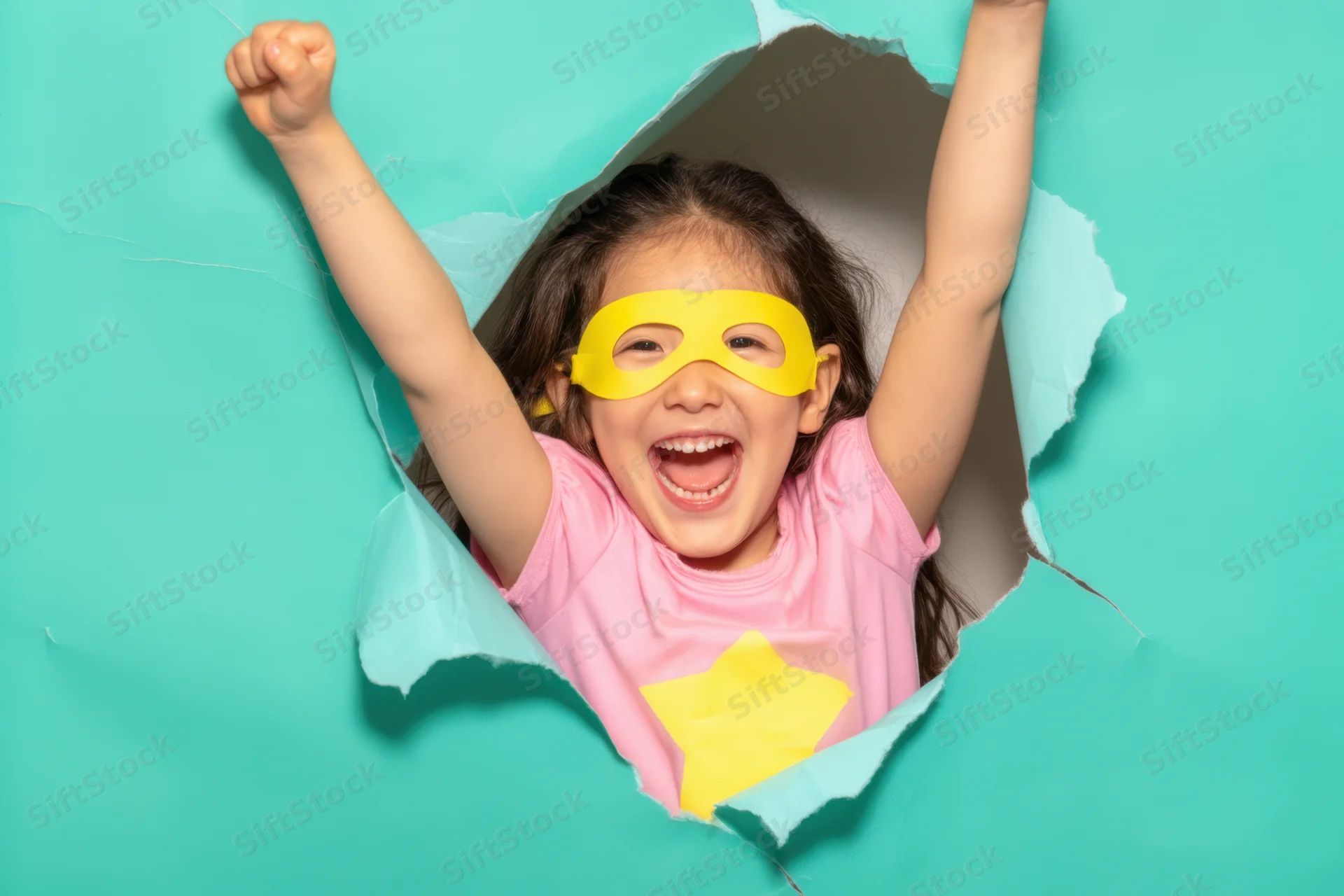 Girl in superhero costume bursting through torn teal paper with arms raised and smiling