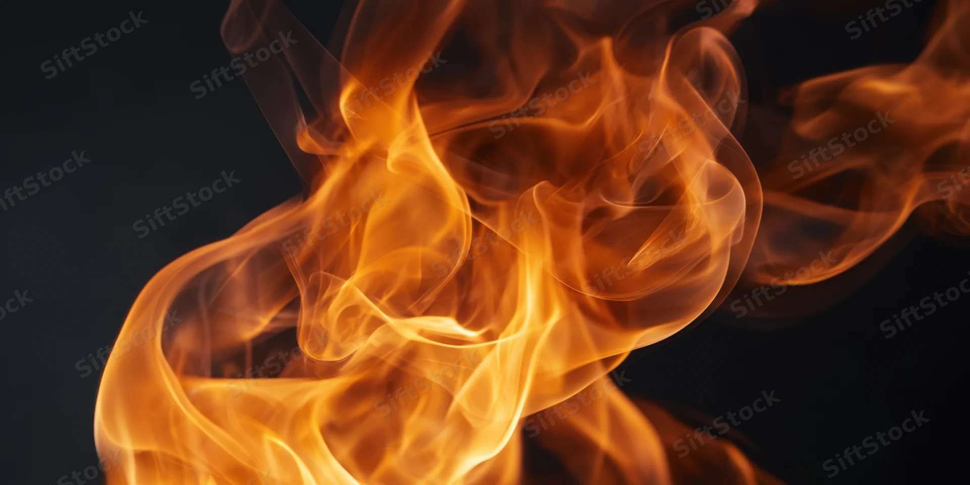 Swirling orange and amber flames rising against a dark background