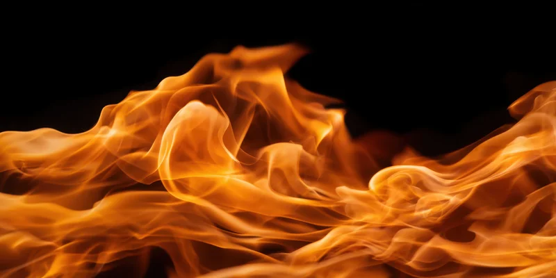 Swirling flames in motion against a dark background