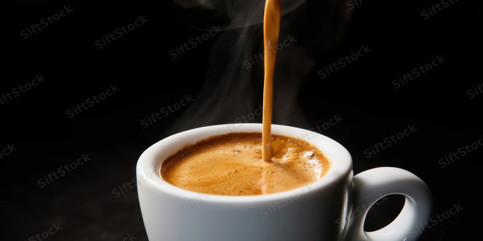 Coffee pouring into a white ceramic cup with steam and crema, dark background