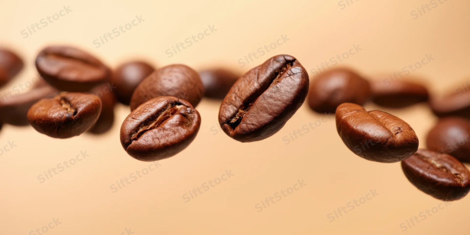 Roasted coffee beans floating in midair above a warm beige background