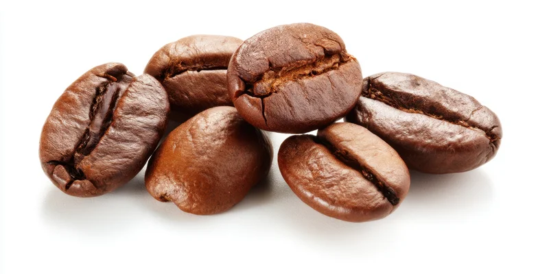 Six roasted coffee beans arranged in a cluster on a white background