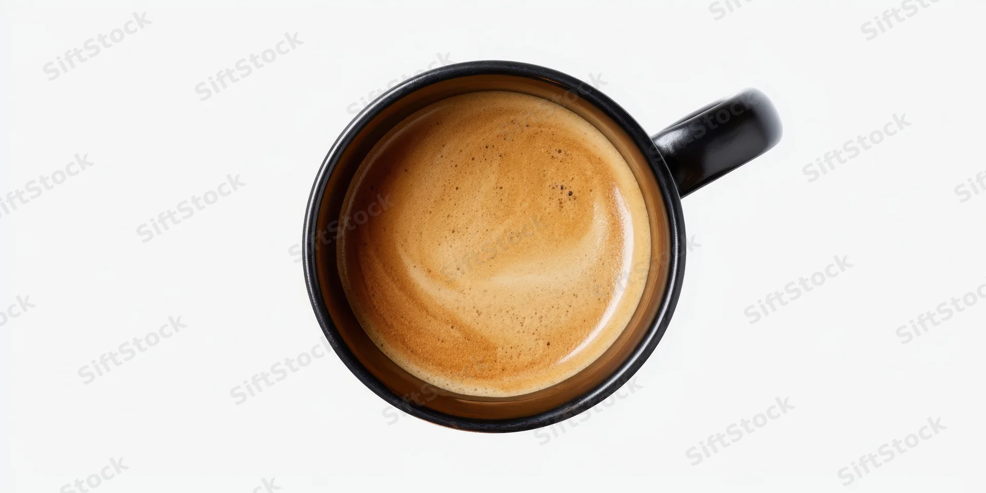 Top-down view of a black ceramic mug filled with coffee crema on white background