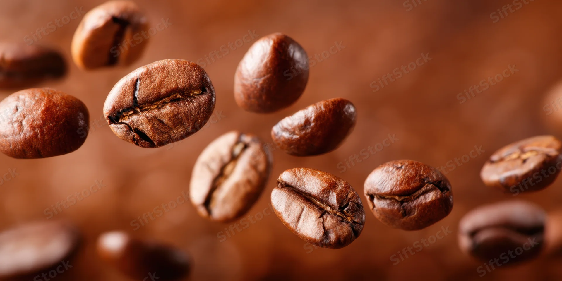 Roasted coffee beans floating in midair in close-up macro view