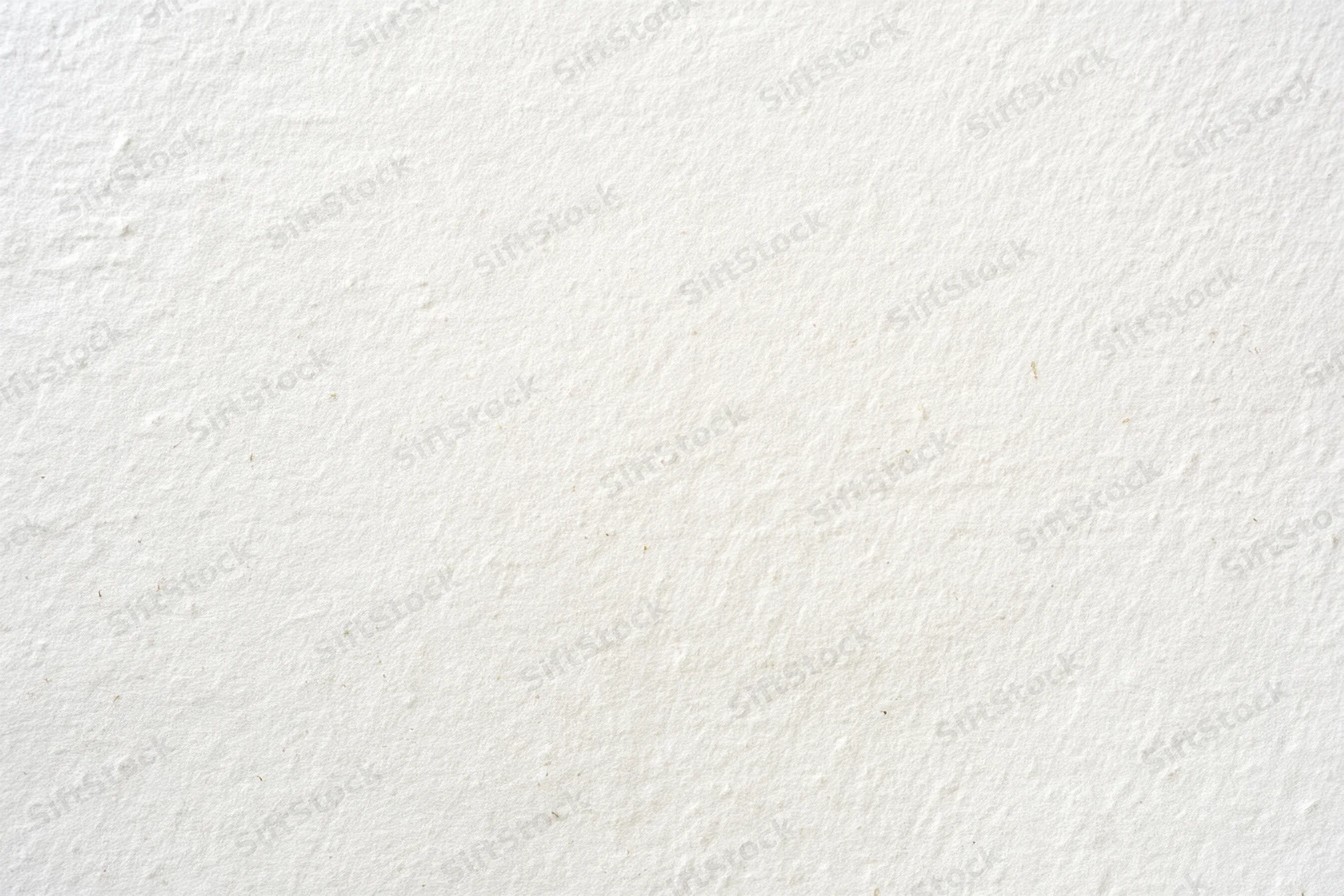 Textured off-white surface filling the frame as a neutral background