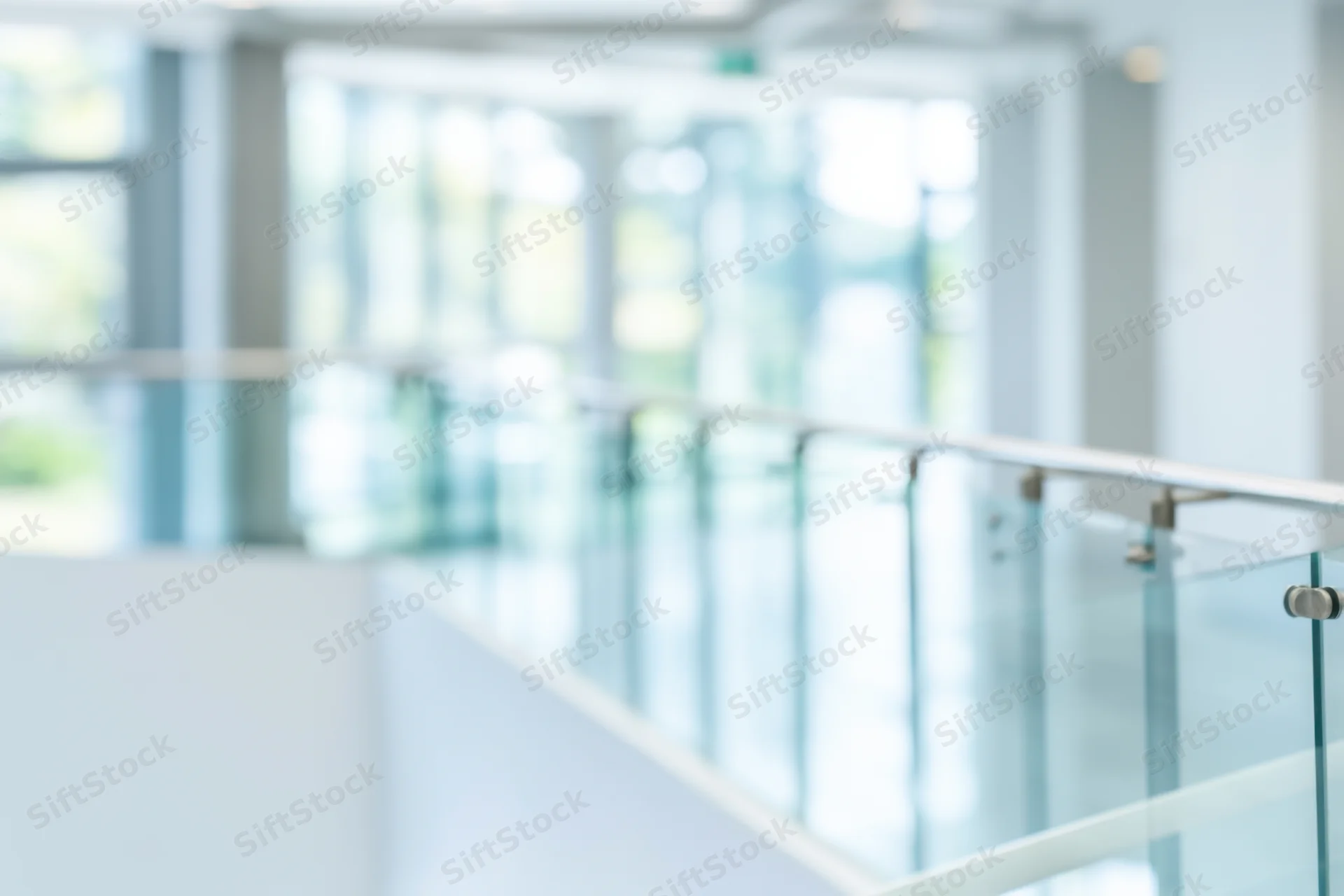 Modern office interior with glass railing and bright open space