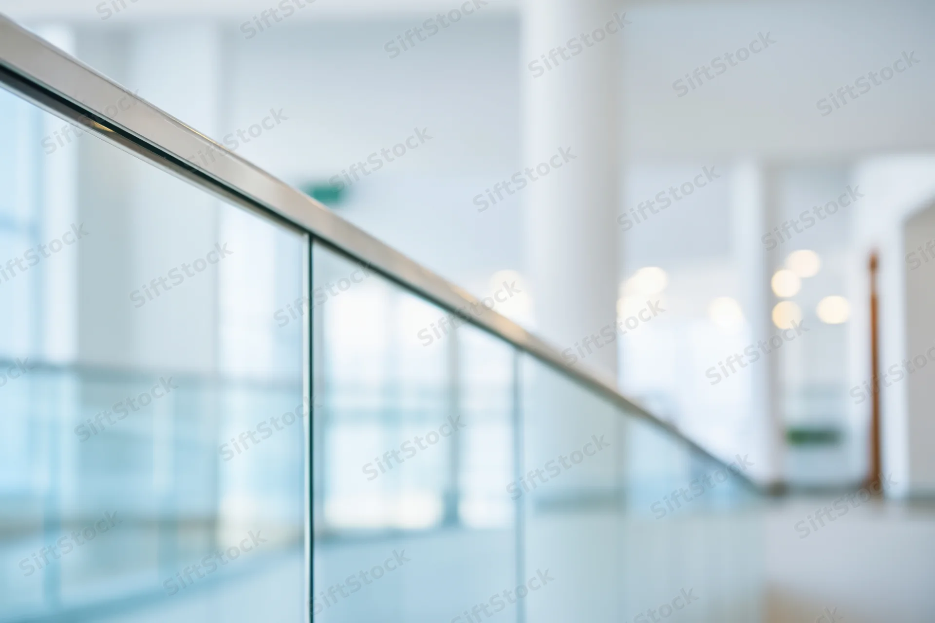 Glass railing in a bright modern office interior