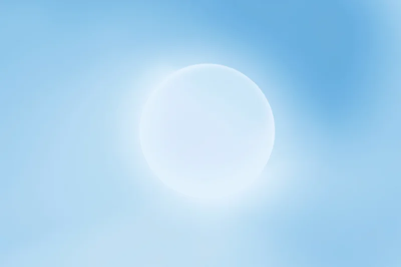 Bright circular sun glow in soft blue sky gradient