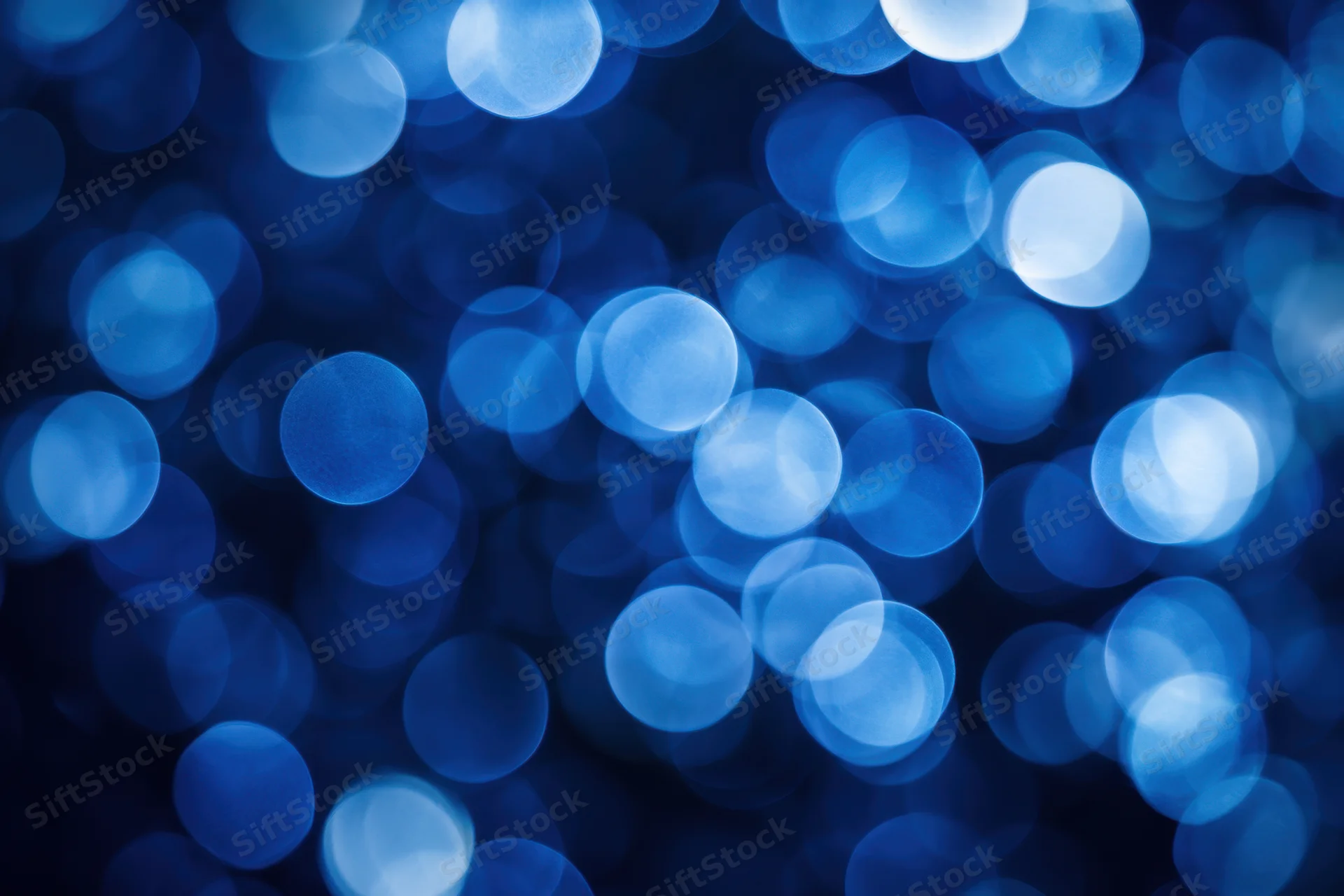 Soft blue bokeh lights forming an abstract glowing background