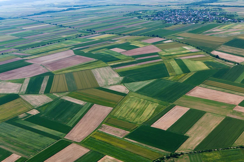 Aerial view of patchwork farmland fields in rural europe