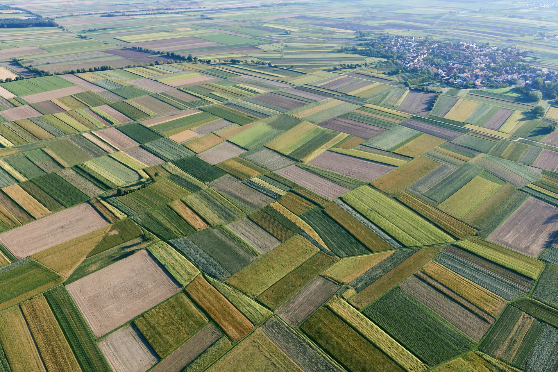 Aerial view of patchwork farmland fields in rural europe