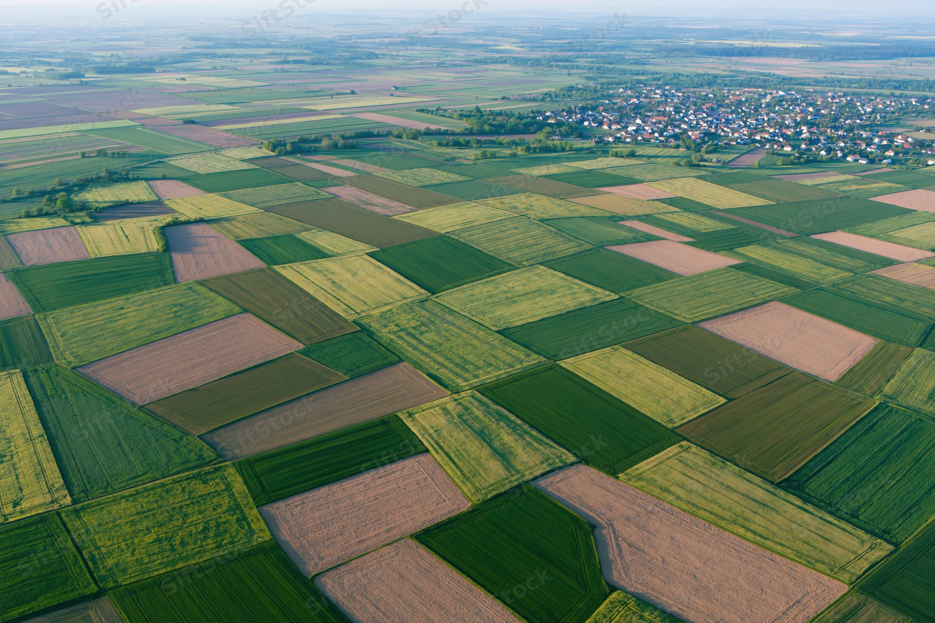 Aerial view of patchwork farmland fields in rural europe