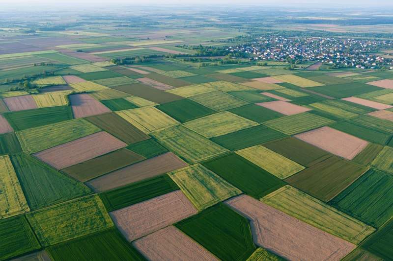 Aerial view of patchwork farmland fields in rural europe