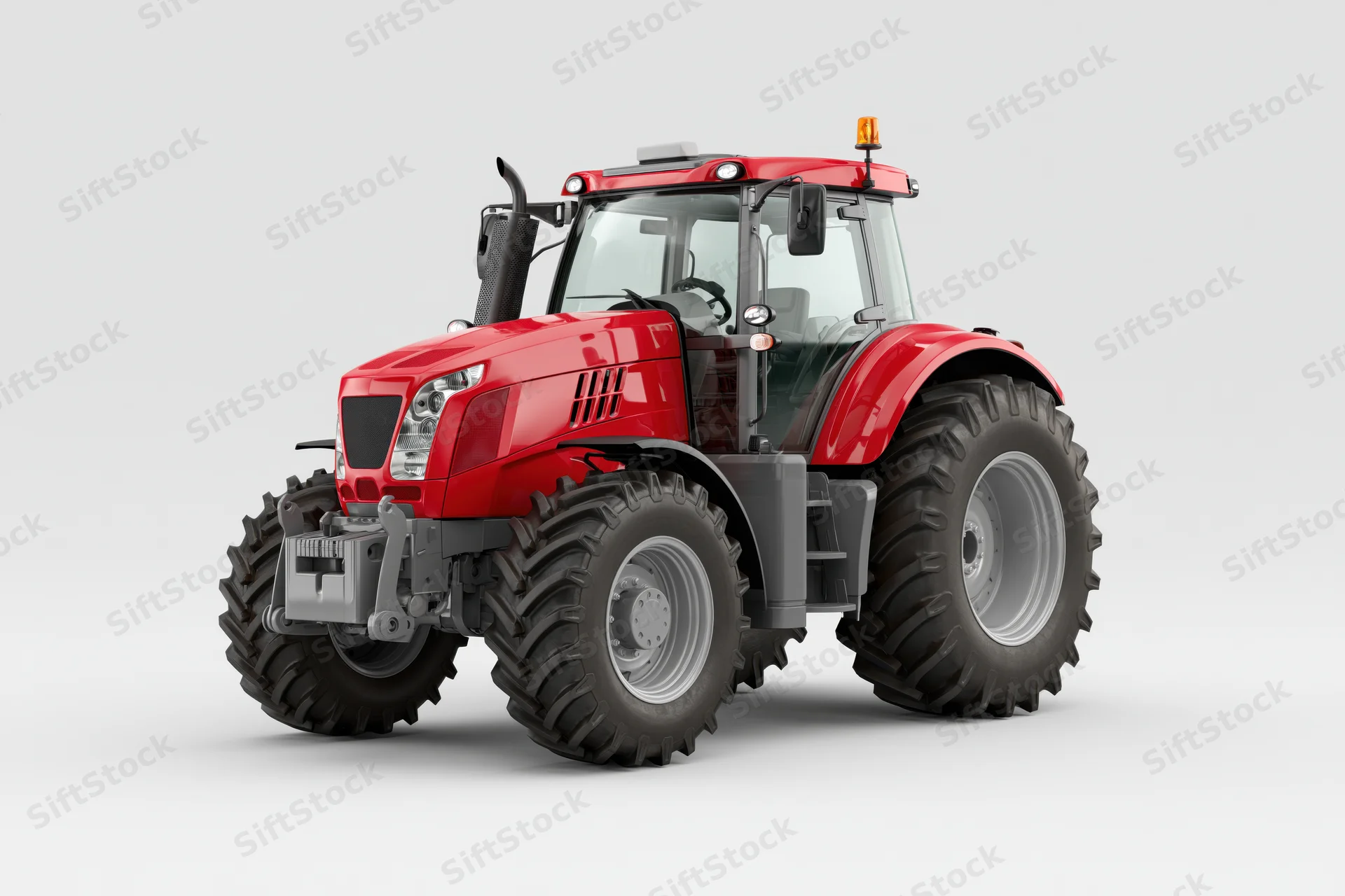 Modern red agricultural tractor parked stationary in studio view