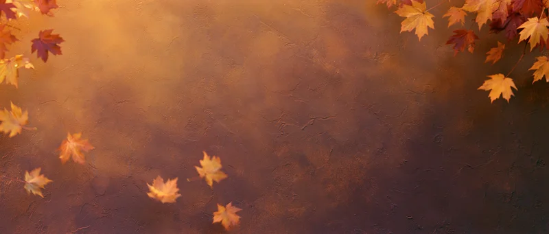 Autumn maple leaves scattered across a textured warm-toned background with copyspace