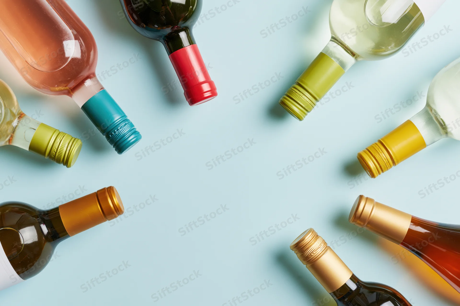 Wine bottles arranged neck-inward around frame edges on light blue background