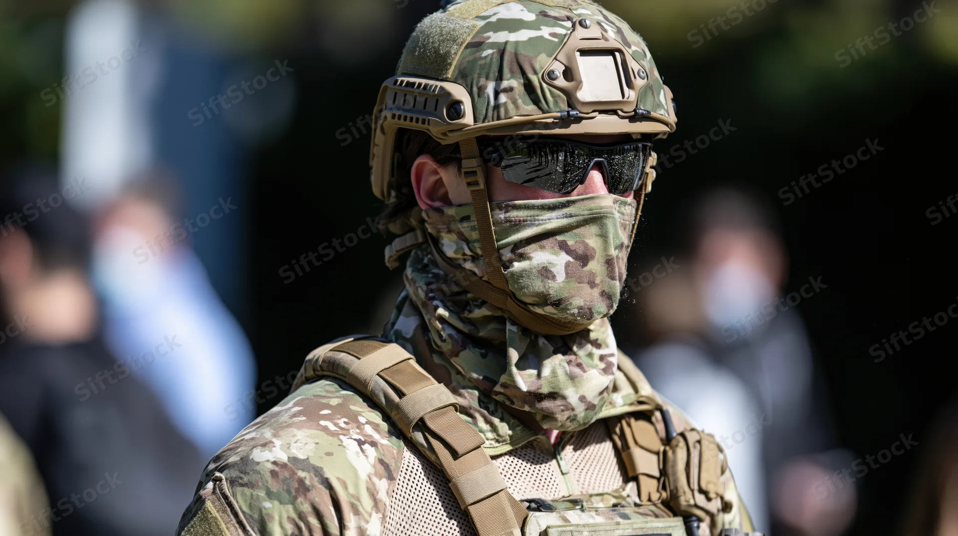 Soldier in camouflage uniform and tactical gear outdoors during daylight