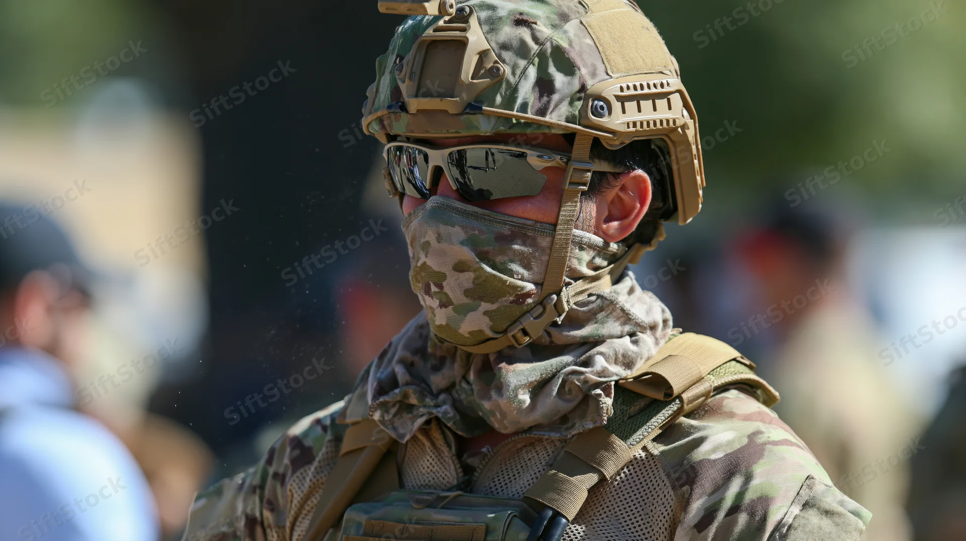 Soldier in camouflage uniform and tactical gear outdoors during daylight