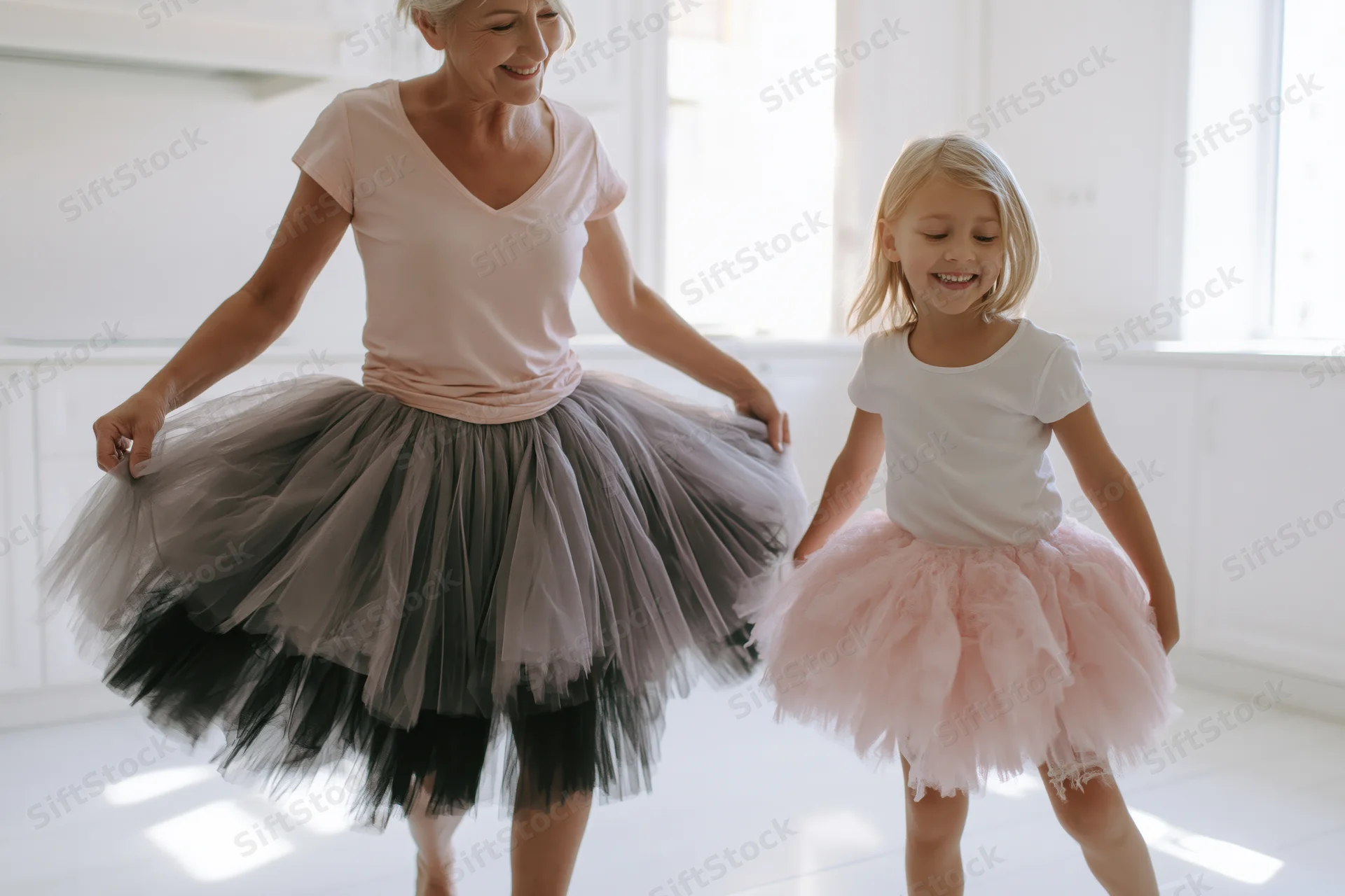 Mother and daughter dancing in tutus in a bright home interior