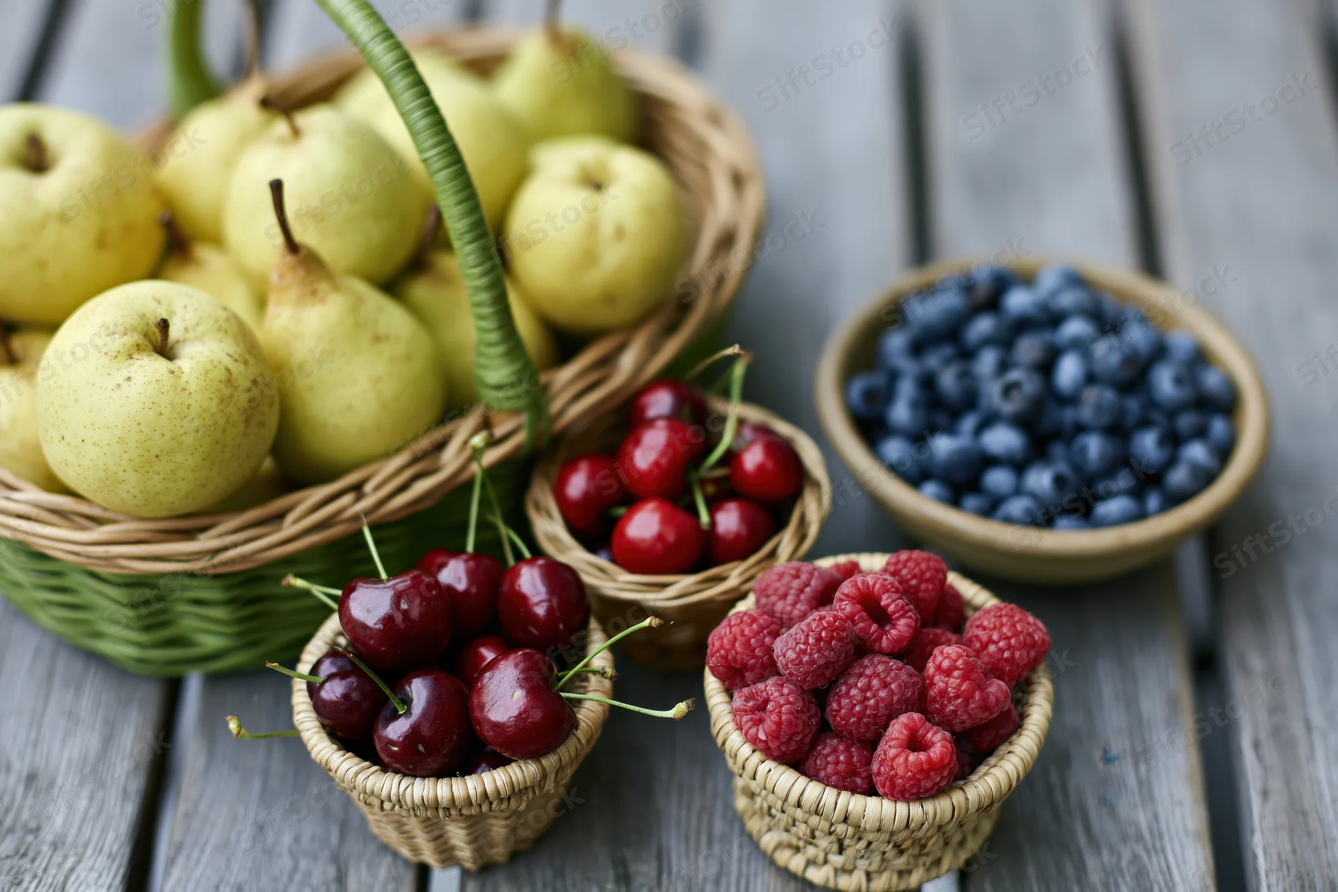 Assorted fresh fruit in woven baskets and small bowls on a wooden table