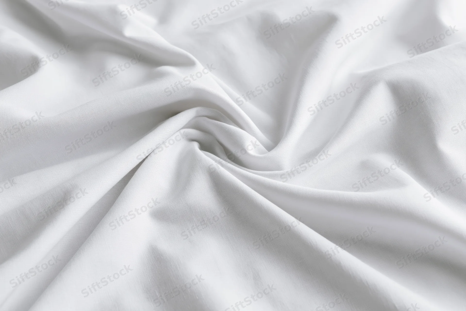Crumpled white cotton bed sheet filling the frame