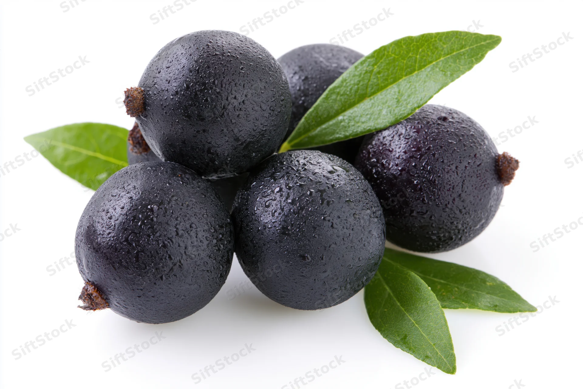 Cluster of fresh acai berries with green leaves on white background