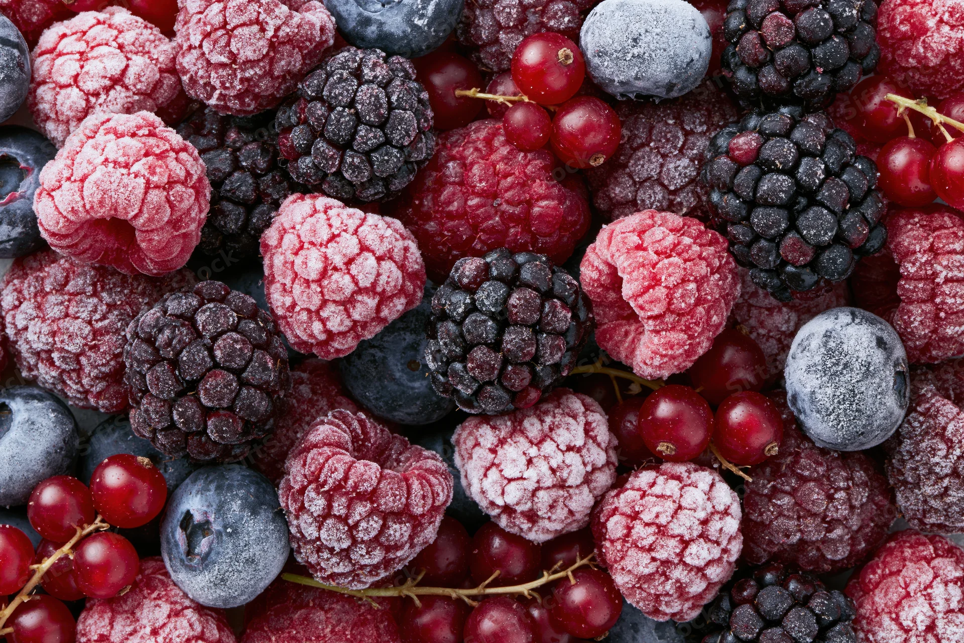 Frozen mixed berries with frost in a flat lay arrangement