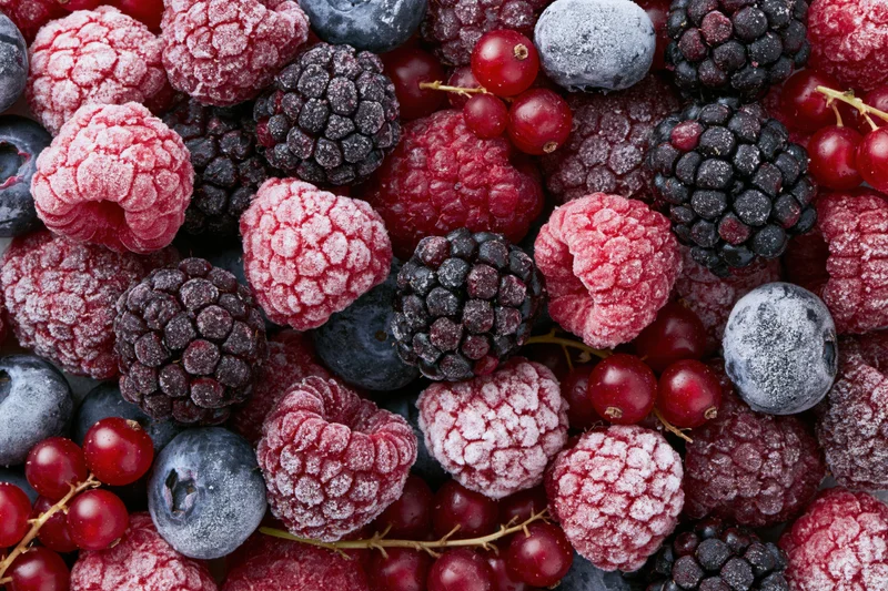 Frozen mixed berries with frost in a flat lay arrangement