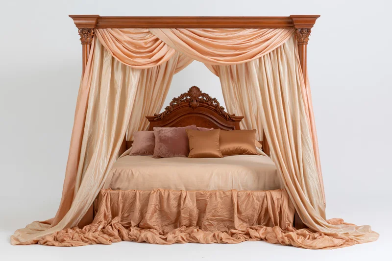 Ornate wooden four-poster bed with draped peach fabric canopy and matching bedding on white background