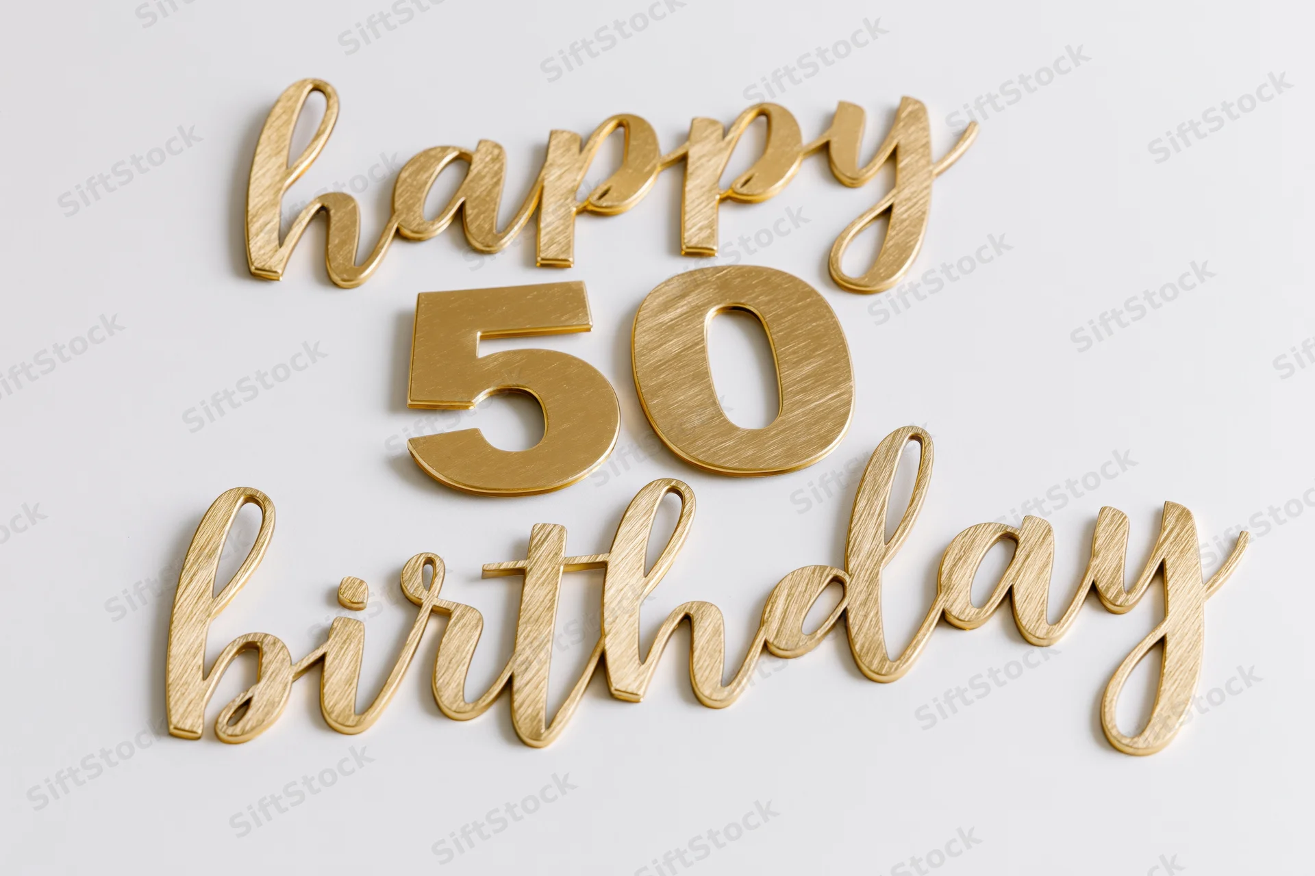 Golden 3d text reading happy 50 birthday arranged on white surface